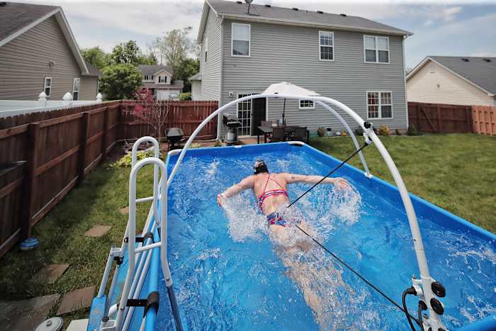 Dahlia's work-around: a backyard iPool, rigged with restraints.